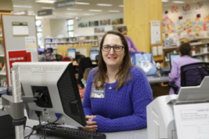 Friendly librarian ready to answer questions (Links to Ask Us web page)