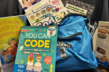 Blue Science to Go backpack with colorful books and activities (Links to Science to Go information)