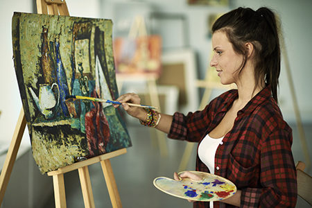 Person painting a picture (Links to Universal Class online resource)